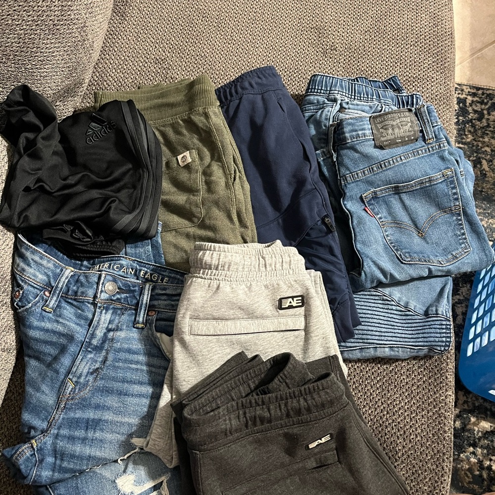 Young men jeans and sweat pants